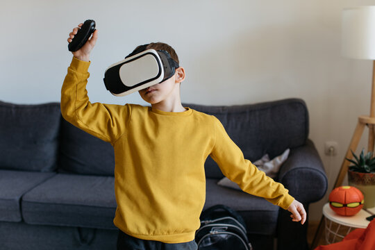 School Boy Playing with VR Glasess