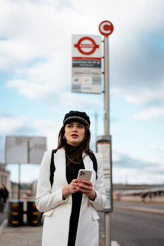 Elegant woman at the bus station 