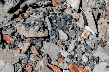 View of crack concrete and tile debris of demolition waste from destruction of buildings at renovate