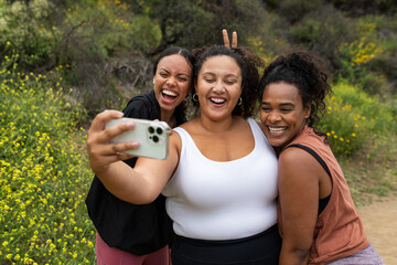 Three Friends Smile For A Selfie