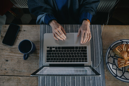 Anonymous woman typing on notebook