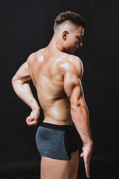 Male Bodybuilder demonstrating his side triceps