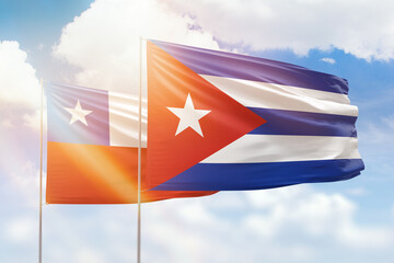 Sunny blue sky and flags of cuba and chile