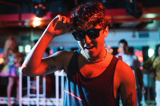 Guy with sunglasses at a club