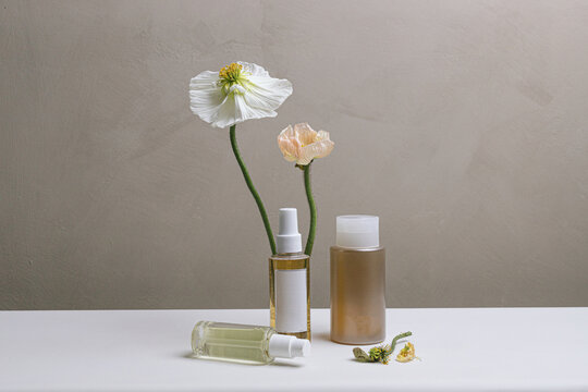 Still life of skincare/haircare product with poppies