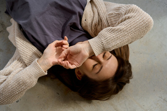 portrait of a woman lying on the floor