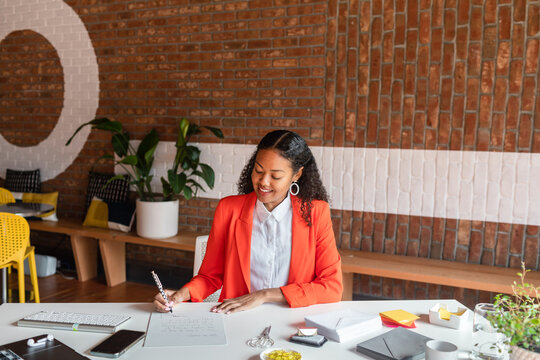 Young businesswoman on blazer at front desk