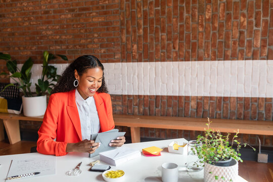 African woman working at office desk