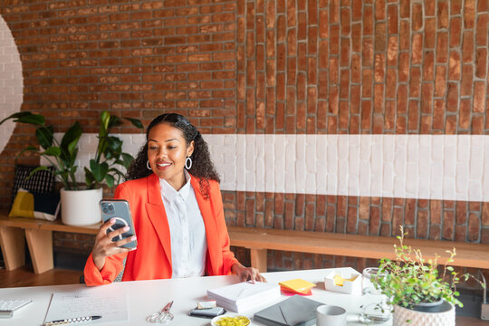 Mixed event manager female with phone in office