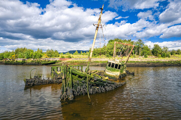Naklejka na ściany i meble Old Boat Wrecks on the River Leven, Dumbarton, Highland, Scotland, UK