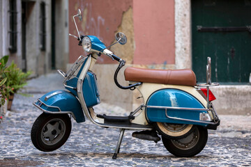Fototapeta na wymiar Vintage scooter parked on the street