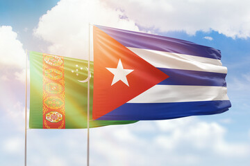 Sunny blue sky and flags of cuba and turkmenistan