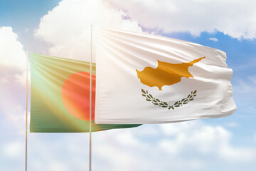 Sunny blue sky and flags of cyprus and bangladesh
