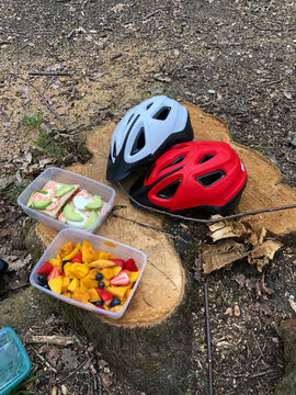 Bicycle helmets picnic in the woods