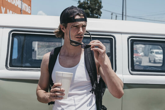 tourist drink a smoothie on the street