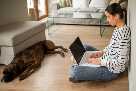 Young woman with a laptop at home