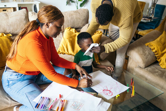 Little boy with his parents at home