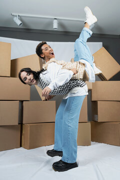 Two female friends in studio fooling around