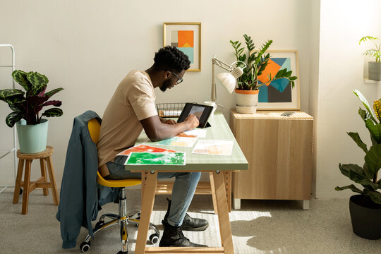 Black man digitizing watercolor designs