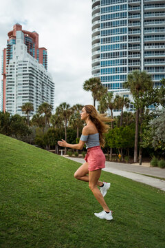 A woman runs in a park in Miami