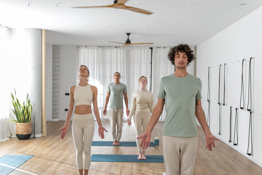 Men and women during yoga session