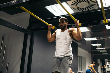 Strong man working out in gym