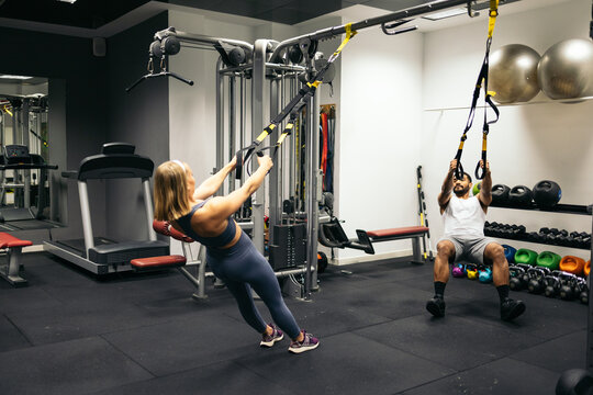 Friends working out in gym