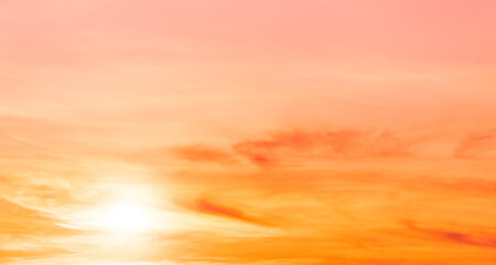 Fototapeta premium Evening sky with sunset romantic colorful sunlight with bright orange, yellow and pink dramatic nature pastel background.