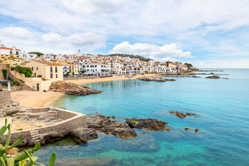 Fototapeta na wymiar The whitewashed fishing village of Calella de Palafrugel near Barcelona on the Costa Brava coast of Southern Spain, with it's rocky coastline, bay and small town.