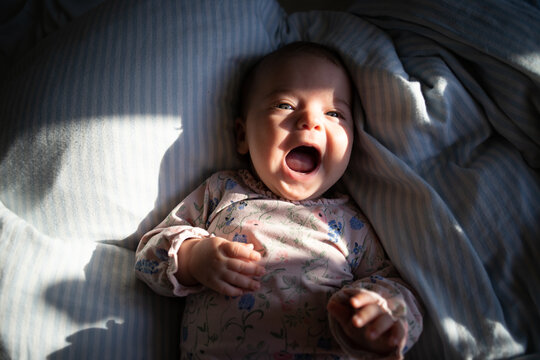 Baby Girl on a Bed