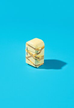 Miniature of taped refrigerator on blue background