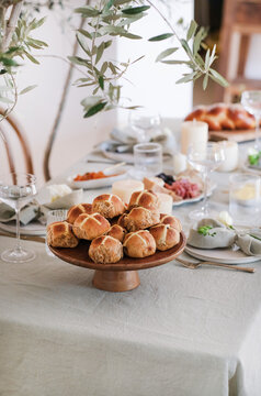 Easter hot cross buns on dinner table