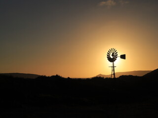 windmill front the sun during the sunset in Australia at Esperance