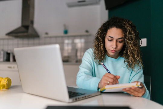 Female student making notes in planner