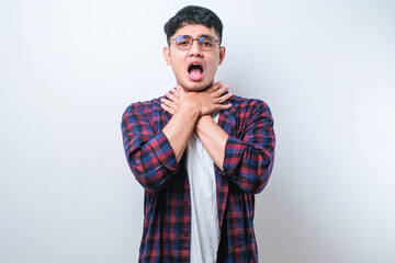 Asian young man shouting and suffocate because painful strangle.
