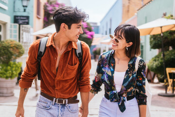 Hispanic Young Couple Walking On the Street