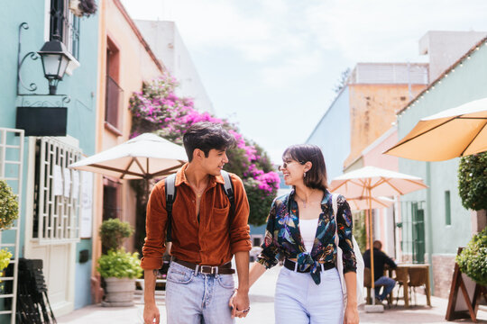 Latin Couple Walking On the Street