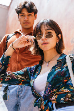 Hispanic Stylish Couple Looking At Camera