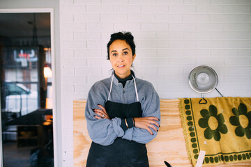 Woman standing with crossed arms
