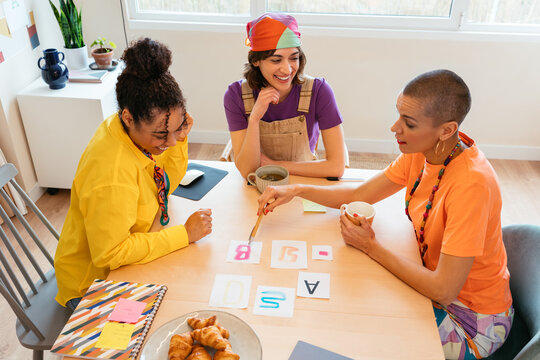 Delightful ladies discussing design at table