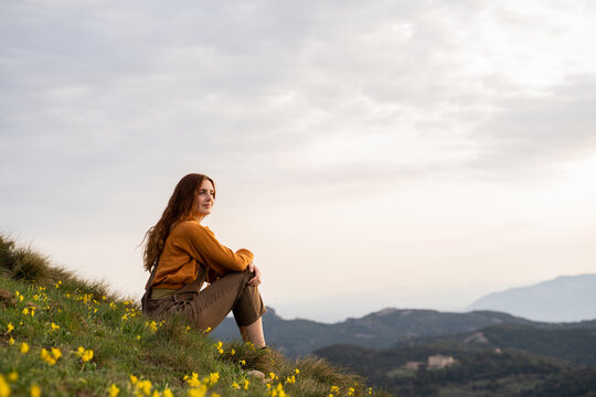 Portrait of happy woman in nature at sunset