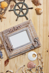 Empty Frame on Wooden Background With Sea Shells and Fishing Net. Nautical and Coastal Theme
