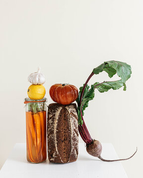 Still life of bread and vegetables