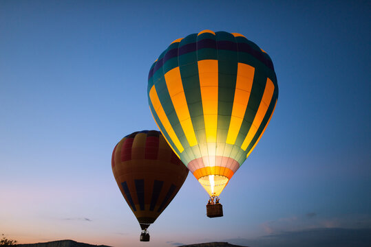 Fototapeta Hot air balloons floating in the air at dawn