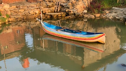Traditional fisherman wooden boat on the lake