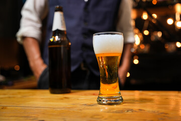 Bartender Serve beer, on wood bar, 