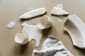 Conceptual still life in white tones with eggshells.