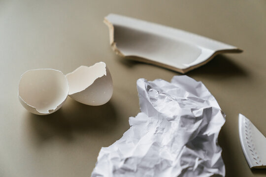 A composition of garbage in white tones.
