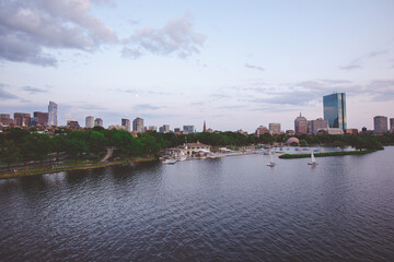 The Charles River Esplanade with sailing boat and urban building city skyline.