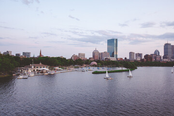 The Charles River Esplanade with sailing boat and urban building city skyline.